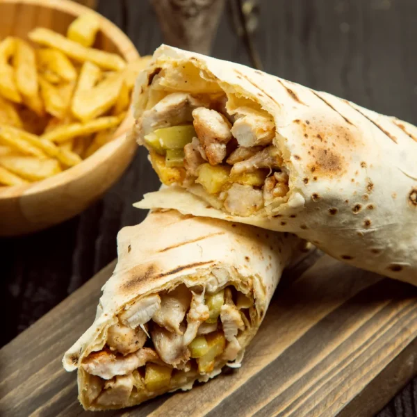 chicken-durum-shaurma-with-lavash-french-fries-wooden-board