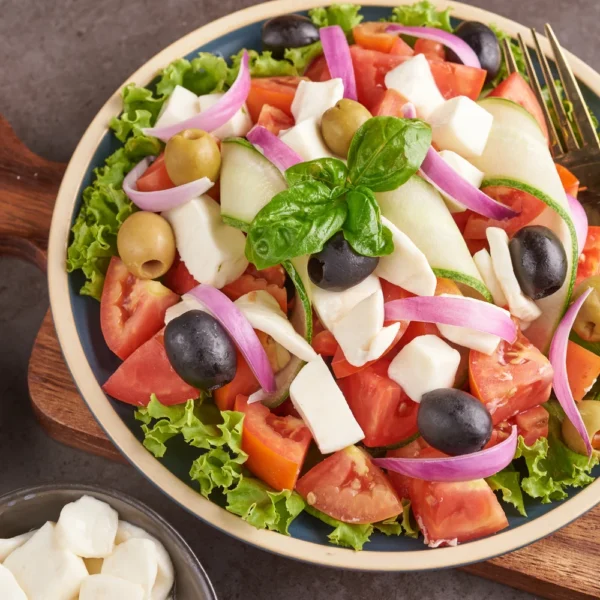 classic-greek-salad-fresh-vegetables-cucumber-tomato-sweet-pepper-lettuce-red-onion-feta-cheese-olives-with-olive-oil-healthy-food-top-view (1)