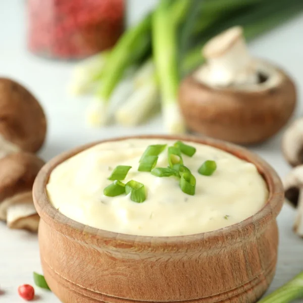 concept-tasty-food-with-mushroom-sauce-white-wooden-background