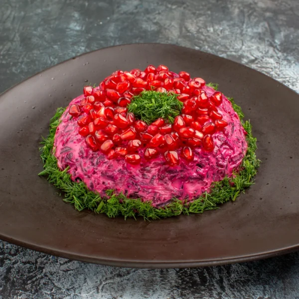 dish-with-pomegranate-sauce-herbs.webp