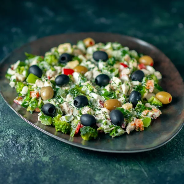 front-view-vegetable-salad-with-mayyonaise-olives-dark-blue-surface-meal-color-holiday-health-dish-photo-dinner