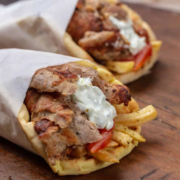 gyro-pita-shawarma-take-away-street-food-traditional-greek-turkish-meat-food-wooden-table