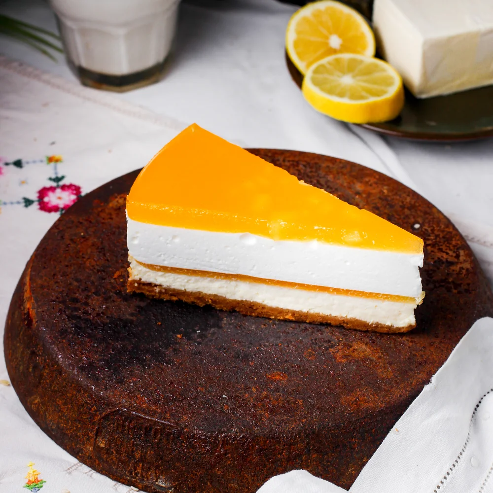 slice-lemon-cheesecake-placed-antique-iron-pan