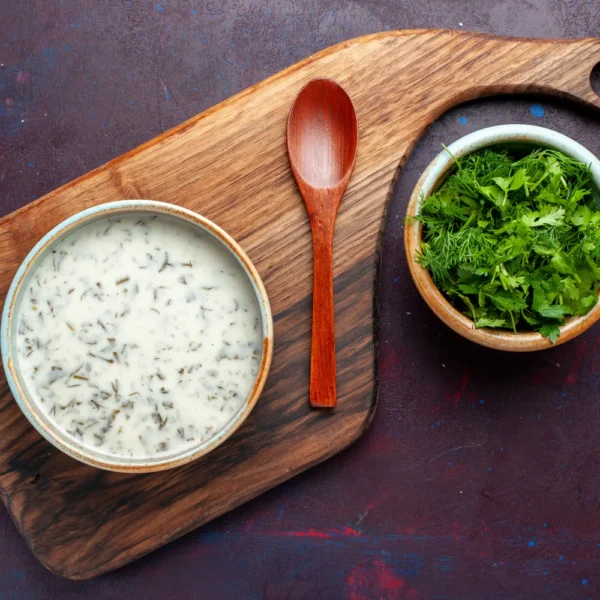 top-view-fresh-greens-inside-round-bowl-with-dovga-dark-table-green-fresh-food-vegetable