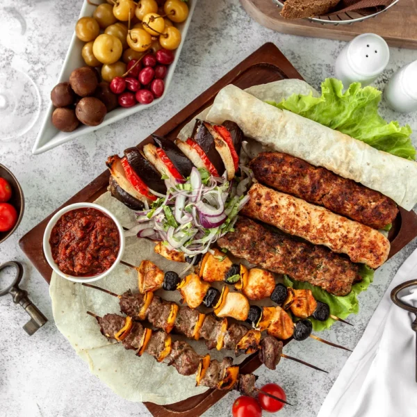 top-view-kebab-platter-skewers-served-with-salad