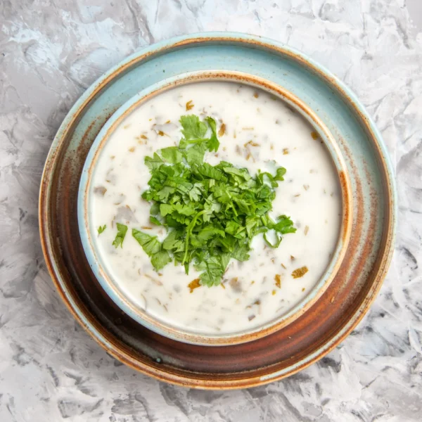 top-view-tasty-dovga-yogurt-soup-with-greens-inside-plate-white-table-milk-soup-meal