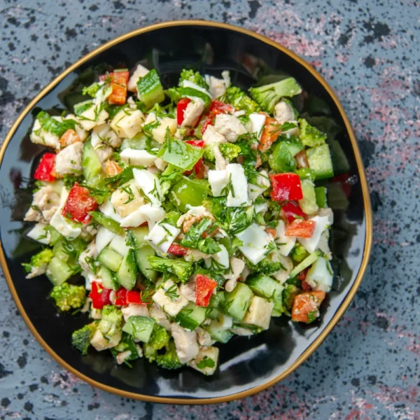 top-view-tasty-vegetable-salad-inside-plate-dark-background-cuisine-lunch-restaurant-fresh-meal-health-diet-color