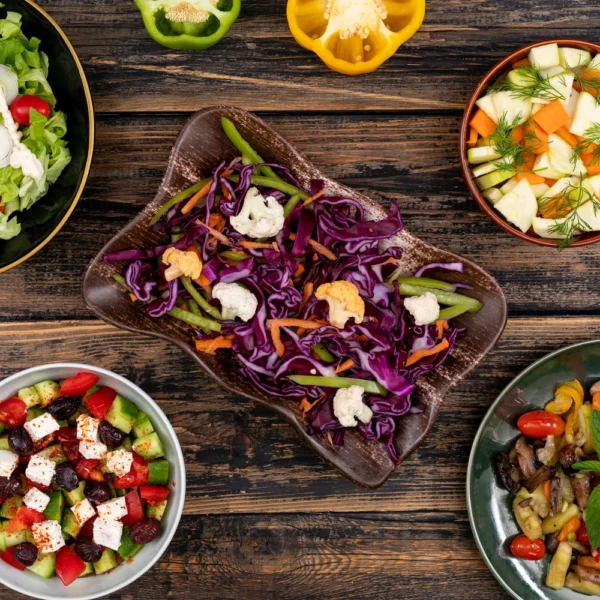 vegan-salads-cabbage-carrots-mushroom-cheese-onion-pepper-top-view-concept.webp